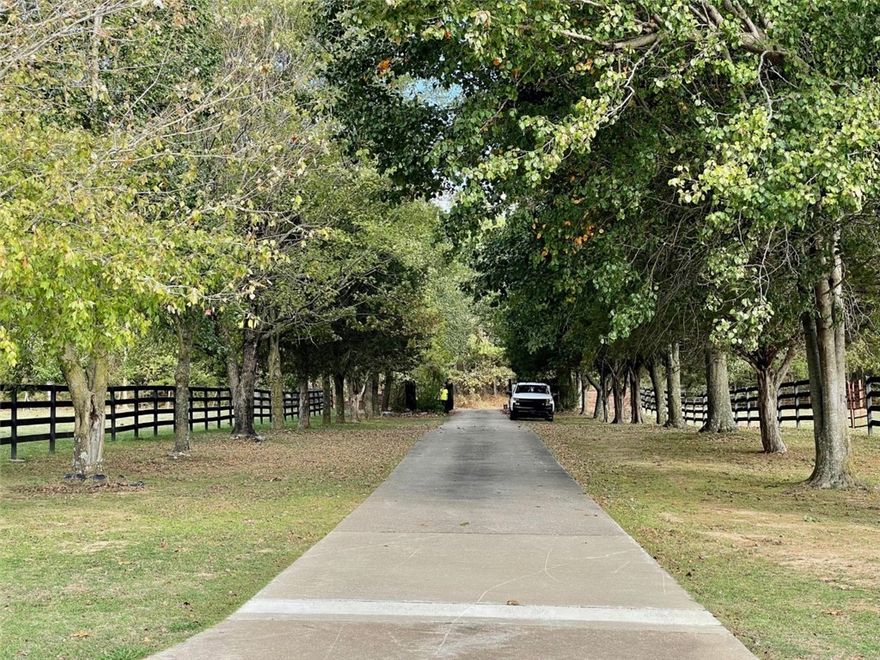 Take the gated, tree lined driveway down to this country estate located just minutes from Fayetteville and Springdale. Home sits on just over 3 acres with amazing views.  Find a 22,000 gallon kidney shaped pool right outside the back door with the same great views. Attached 2.5 car garage with a 5 car carport located across the driveway. Large metal shop building with room for all of your toys. Home has updated granite and stainless kitchen, split floor plan, two offices and two living rooms, a sunken den, and so much storage.  Large utility room and formal dining. Covered front patio is perfect for entertaining.
