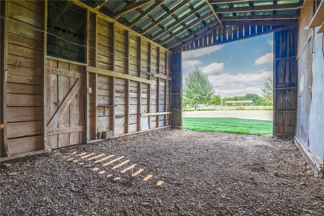 Close to downtown Pea Ridge but with a nice country setting! Great single-wide on almost 1 acre - 2 lots, new kitchen, new water heater, new heat pump, more! 3 carports, 10x12 Morgan Building, 12x24 cabin (fully wired, own breaker-box, walls insulated, hot tub on porch) Awesome above-ground storm shelter, great barn with workshop. Full RV hookup behind barn includes septic use. 2 walk-in showers. Living room has vaulted ceiling and is open to the kitchen. Kitchen has plenty of cabinet space and an eat-in space. Public water but has a well as an alternative water source. Enjoy the natural surroundings! Don't miss this one!