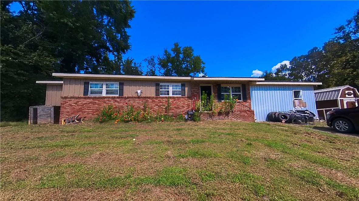 Looking for more bedrooms? Here's the house for you! Currently being used as a 5 bedroom 2 bath home on a little less than an acre! Finish a few minor details and reap the rewards of a spacious home!