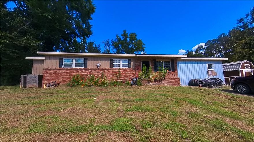 Looking for more bedrooms? Here's the house for you! Currently being used as a 5 bedroom 2 bath home on a little less than an acre! Finish a few minor details and reap the rewards of a spacious home!