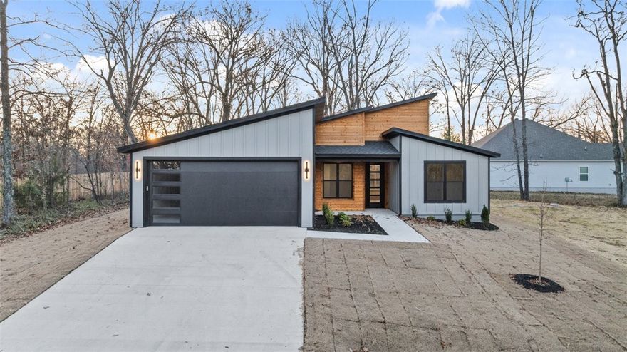 Beautiful and unique contemporary new construction on a flat lot! This 2-bed, 2.5-bath home features an eat-in kitchen with waterfall island, one-piece backsplash, electric range, a hidden walk-in pantry, and an office. No carpet—just tile and premium LVP throughout. Built with Zip System sheathing and Solar Board roof decking to keep the home energy-efficient and the attic up to 40° cooler in Summer. Windows are an upgrade over basic Builder windows. Upgraded front door. Wind and rain underlayment under 3D architectural shingles. Two master bedroom suites ensure you and your guests are comfortable and have privacy. A portion of the deck is covered and a portion is uncovered for all seasons pation usage. You're gonna love this floor plan.