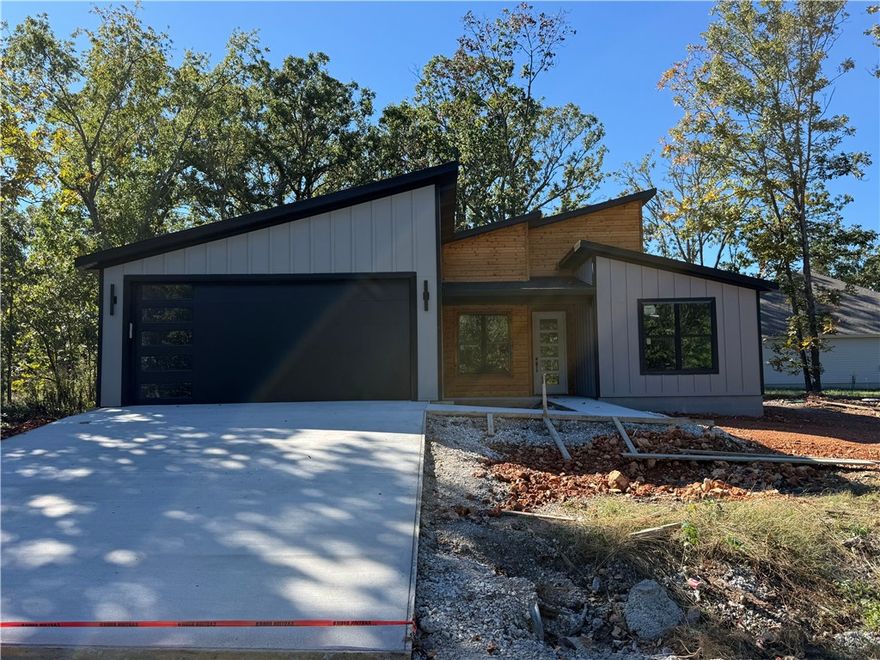 Beautiful and unique contemporary new construction on a flat lot! This 2-bed, 2.5-bath home features an eat-in kitchen with waterfall island, one-piece backsplash, electric range, a hidden walk-in pantry, and an office. No carpet—just tile and premium LVP throughout. Built with Zip System sheathing and Solar Board roof decking to keep the home energy-efficient and the attic up to 40° cooler in Summer. Windows are an upgrade over basic Builder windows. Upgraded front door. Wind and rain underlayment under 3D architectural shingles. Two master bedroom suites ensure you and your guests are comfortable and have privacy. A portion of the deck is covered and a portion is uncovered for all seasons pation usage. You're gonna love this floor plan.