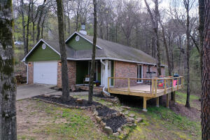 This wonderful home is situated cozily on a hillside on a dead in street just outside of Russellville. This 3 bedroom, 2 bathroom home has over 1300 square feet of heated and cooled living space, a one car garage, and a wonderful deck for playing, entertaining, or relaxing! Home is situated on a corner lot on approximately .7 acres! Check out the 360 tour or book your showing asap!