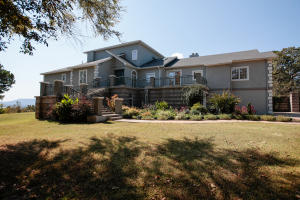 Mansion on the Mountain Top! Overlooking Lake Dardanelle high atop a gated private 42 acres of woods and tranquility, this custom crafted mansion awaits. The scenic views can be enjoyed from one of many patios, or as you wander on the private walkway that winds through entire 42 acres. Boasting 4 Fireplaces that can be wood or gas, a new roof, updated HVAC, and newly remodeled kitchen and Executive bedroom suite, library and much more this home has a little of everything. A large shop with plenty of storage is perfect for woodworking, car enthusiast or both.