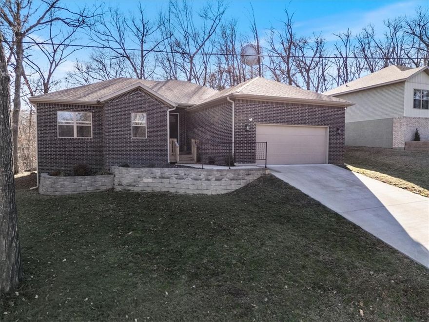 Welcome to 8 Leyland Drive, a stunning blend of modern elegance and cozy comfort in the heart of Bella Vista. This sanctuary offers a thoughtfully designed floor plan featuring 3 spacious bedrooms, 2 bathrooms, plus a dedicated office—perfect for the remote professional or creative soul. As you step inside, the 10-foot ceilings create an airy, expansive feel. Large windows invite a wash of natural light, highlighting the clean lines and high-end finishes that define the space. The primary suite includes a statement wall, private bath with a tiled shower and garden tub. Whether you’re hosting friends in the open-concept living area or enjoying a quiet morning in the sun-drenched kitchen, every corner feels intentional and inviting. Located just minutes from Bella Vista’s world-class trails and lakes, this home isn't just a place to live—it’s an invitation to a better lifestyle. From the moment you enter, you’ll know you’ve found something special. Come in, stay a while, and fall in love.