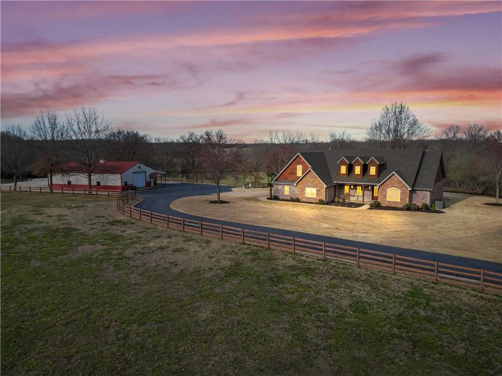 Amazing estate property! Location is convenient to Farmington or Fayetteville! The home sits on a manicured 10 acres mol with multiple outbuildings and overlooks a beautiful valley! This custom built 1 owner home has a great layout for large families or entertaining! The living area is open concept and the bedrooms are huge! Too many amenities to list so come see this for yourself! The setting and location is second to none! Shop building is 40x60 and it includes lean-to stalls and also a separate pole barn. Total Acreage amount 10.11. Parcel ID# 760-02374-012 (5.40), #760-02397-001(2.66 acres),#760-02374-011 (2.05 acres). The riding arena and shed do not convey.