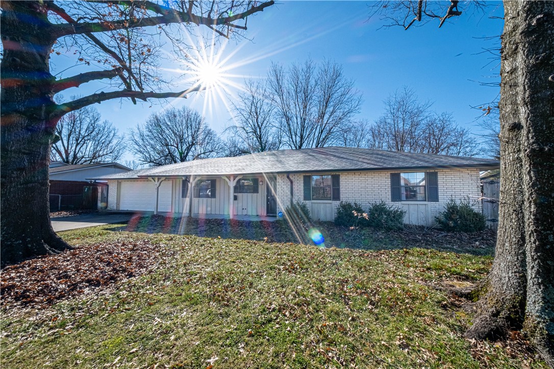 Location, Location! This three bedroom, two full bath house with freshly remodeled kitchen and bathroom. In the kitchen granite countertops and gas oven/ran that opens up to the living room with a wood burning fireplace. The master bedroom offers a walk-in closet and walk-in shower. The house comes with a two garage and fenced in back yard and Fridge with washer/dryer connections.