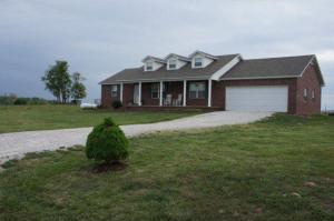 BRICK HOME WITH APPROX 5 ACREs!!! Newer 3BR, 2BA home with awesome view. Beautiful hardwood floors, 2-car garage, fenced backyard, nice deck in back & covered front porch. Move in readyjust waiting on you!!