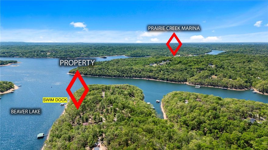 Rare Deep-Water Lake Front Acreage in Coose Hollow on Beaver Lake!
Claim your slice of Northwest Arkansas paradise with ~227’ of Beaver Lake frontage in desirable Coose Hollow (fronting Little Coose Hollow). This premium 2.12-acre lot offers a highly private setting with a gently rolling, sloped terrain, open clearings, and mature hardwoods. Situated in a wide cove with deep water, it includes a private swim dock with its own beach area, all just minutes from Prairie Creek Marina. Enjoy paved road access surrounded by beautiful homes. Recent septic soil test is available with an acceptable offer. High-end custom architectural plans are available for purchase separately. Only 20 minutes to Downtown Rogers and 30 minutes to the Bentonville Square. Buyer due diligence to verify all utilities. Photo boundary lines approximate