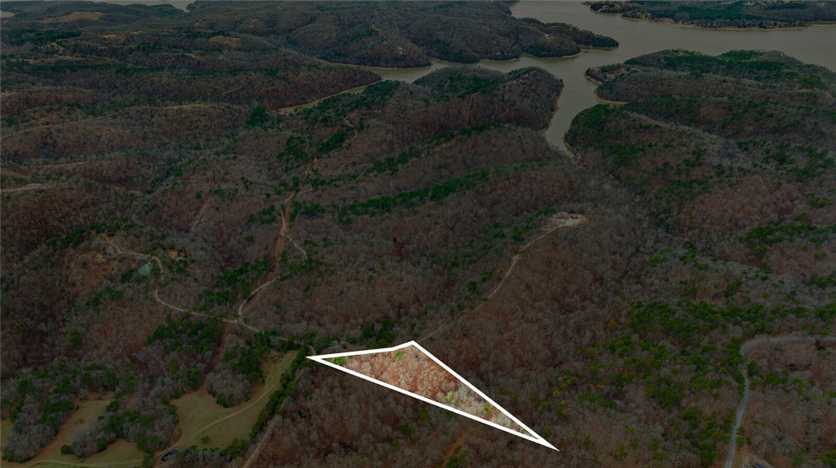 Discover the perfect canvas for your dream home with this stunning 5-acre tract in Emerald Bay subdivision. Boasting breathtaking views and endless potential, this property offers a serene retreat near the lake. While well water and septic are needed, electricity is already on-site, making your building process more convenient.
Located just minutes from the historic War Eagle Mill and a short drive to downtown Rogers, youāll enjoy the perfect balance of peaceful living and easy access to amenities. Whether youāre envisioning a custom home or a weekend getaway, this property provides the ideal setting to bring your vision to life. Donāt miss this rare opportunity to own a slice of Emerald Bay!