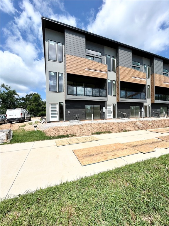 Modern living located across the street from Airship Coffee! Situated near the Crystal Bridges trail and the downtown square, this brand new CORNER UNIT condo offers both convenience and contemporary design. The property includes an attached 2-car garage and a community bike wash station, perfect for outdoor enthusiasts. Additional neighborhood amenities feature an outdoor grill and a fire pit, ideal for social gatherings. The contemporary kitchen is a highlight, featuring European cabinetry, exquisite quartz countertops, and a waterfall island. With modern fixtures and high-end finishes throughout, this condo exemplifies quality. Enjoy the elegance of glass balconies and the comfort of 3 luxurious bedrooms. This condo also includes 3.5 baths, designed with style and functionality in mind. Experience the ultimate luxury lifestyle with this exceptional property. Additional units are available.