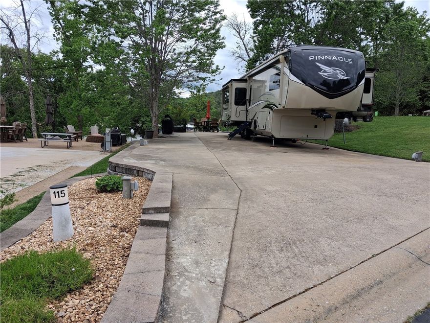 Welcome to your perfect getaway at Ozark RV Resort overlooking beautiful Table Rock Lake! This spacious back-in site offers full hookups and is thoughtfully designed for comfort and convenience, making it ideal for weekend escapes or extended stays. Enjoy stunning lake views right from your lot, surrounded by well-maintained landscaping that adds to the peaceful, resort-style atmosphere. The resort is packed with top-tier amenities including walking trails, activity center, 2 pools, pickle ball and a fitness center. For you outdoor enthusiasts, the location is unbeatable—Table Rock Lake is known for its serene sunsets and fantastic fishing opportunities, making it a dream destination for anglers and adventure seekers alike.