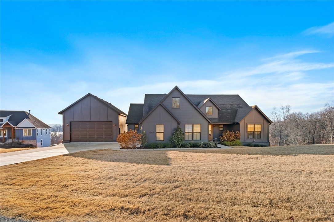 The complete lake experience is set up, ready and waiting on you! Step inside and enjoy the gorgeous views from inside the home or while relaxing by the fireplace on the back deck. This 3 bdrm, 3 bath home showcases 2 master suites, an open split floor plan w/3rd bdrm having built-in bunk beds. Designer touches throughout the home include several upgrades like custom cabinetry, luxury vinyl plank flooring, modern lighting, gourmet kitchen, built-ins and so much more. As spectacular as the homes is, the newly added 25x30 garage/shop w/10ft garage door, epoxy floors, hexagon shop lights & led lights, heated/cooled & Sonos is impressive on its own. And, most importantly w/any lake home, the dock! This home comes w/a 28ft boat slip in community boat dock & lakefront common area. Invisible fence, starlink & most furniture convey w/ home. Option to purchase 2023 Masterceaft X 24 fully loaded Gladiator garage storage & gym equipment.