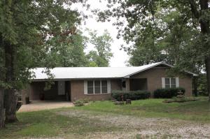 4 bedroom 3 bath all brick home sitting on beautiful and shady 11.5 acres that includes the headwaters of scenic Jasper creek.