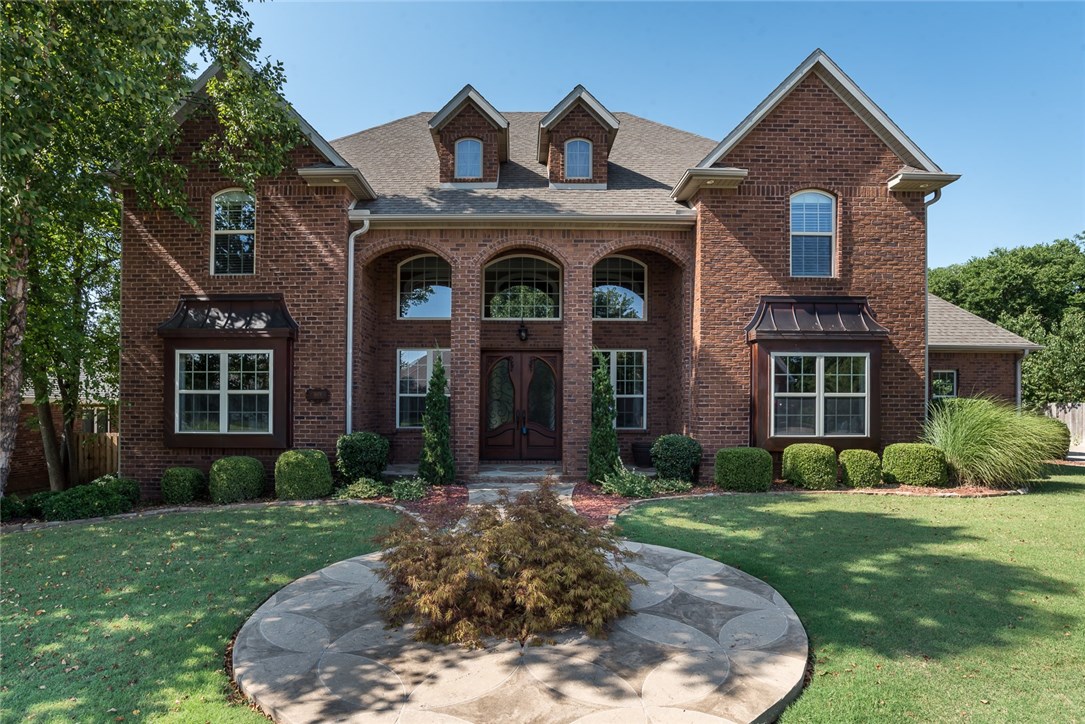 Check out this grand 4,288 square foot, 4 bed/4.5 bath Windsor Manor home with stunning details. Kitchen and master bathroom have been completely updated. This home features granite throughout, custom crown molding & wainscoting, hand scraped hardwoods, custom built-ins, and professional landscaping. The beginning of the banister is made of finely crafted wood, imported from Italy. Prepare a culinary feast in the chef's kitchen, enjoy a movie night in the media room, or relax by the fire on the covered patio. Conveniently located in Bentonville.