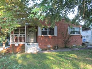 Adorable cottage style brick home with gas log fireplace, sunroom, patio, 12'x20' garage, large living room & much more! All #'s are approx., age is estimate, sq. footage per assessor. Property is Lender-owned, being sold AS IS and the Bank is making no representations or warranties.