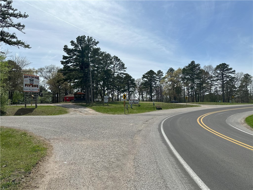 Ready to use or develop for commercial, residential, nightly rental, RV Park or a mixed-use property. +- 380' of frontage on high traffic Hwy 62 in the heart of hospitality and commercial use properties. High visibility, easy access, high traffic and all utilities make this the perfect site for a wide variety of uses. Zoned c-2-C. Two tracts; 4.12 acres with Hwy frontage and flat ground which includes a +- 600 sq ft fully equipped food service building and smokehouse + an adjoining 1.7 acre tract with frontage on Rock House Rd. Contact agent for copy of Zoning & Uses guidelines.
Note the following regarding land area:
Parcel 925-02202-00 indicated as 4.12 acres on Carroll County tax rolls appears to actually be 3.66 acres as indicated by previous survey and deed, both attached as supplements.
Parcel 001-07780-000 indicated as 1.70 acres on Carroll County Tax rolls appears to actually be 2.0 acres as indicated in Warranty Deed attached as a supplement. No survey on file.