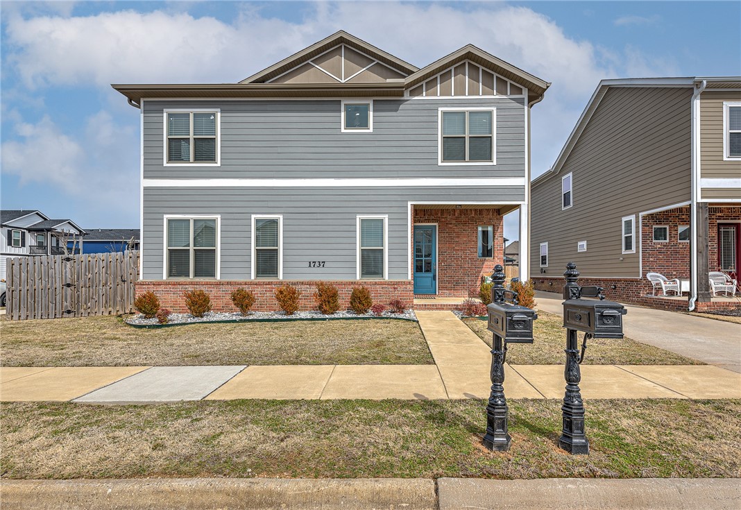 Located in The Grove, one of the areas most desirable locations! This corner lot provides a nice sized yard and great views from the 2nd level covered patio. Primary suite is on the main level and offers a generous lounging or home office area along with an additional laundry hook up. Dual vanity, large walk in shower, soaking tub and a great walk in closet. Open concept main areas with high ceilings, accent lighting and stunning acacia wood flooring. Generous kitchen with island seating and a spacious dining area flows nicely to the living room. Gas log fireplace and plenty of natural light. Spacious guest bedrooms upstairs with ample closets and neutral paint throughout compliments a variety of decor styles. Stainless appliances and microwave in the island plus a large pantry. Upstairs loft offers flex space for a playroom, study or 2nd living room. Don't miss the open house on March 13th from 2pm-4pm
