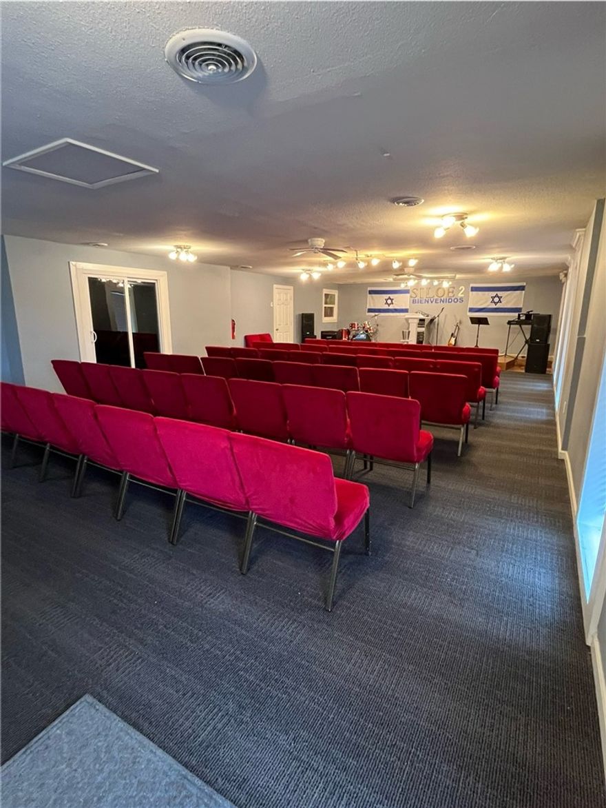 If you're looking for a great location close to I-49 and all the amenities that come with it, this property might be the perfect one for you. Located near I-49, restaurants, gas stations, and Walmart, this building is clean and very well kept. With plenty of parking space, new paint, new carpet, new flooring—perfect for a daycare or small business office space! It has been sued as two small offices with a shared a kitchenette and 2 restrooms and a spare room. Currently used as a church. New Roof 10/2024 Property to be "sold as is."