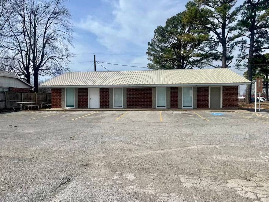 If you're looking for a great location close to I-49 and all the amenities that come with it, this property might be the perfect one for you. Located near I-49, restaurants, gas stations, and Walmart, this building is clean and very well kept. With plenty of parking space, new paint, new carpet, new flooring—perfect for a daycare or small business office space! It has been used as two small offices with a shared a kitchenette and 2 restrooms and a spare room. Currently used as a church. New Roof 10/2024. New photos added. Property to be "sold as is."