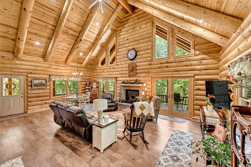 Beaver Lake Cabin Retreat with Guest House & Workshop – 5 Minutes to Clifty Boat Ramp
Discover your perfect Ozark getaway on approximately 15 wooded acres between Eureka Springs & Rogers, AR. Just 5 minutes from Clifty boat ramp on Beaver Lake, this property offers everything you need for year-round fun, fishing, boating, hiking, & relaxing. The gorgeous log cabin features an open-concept living area with a cozy fireplace & a lovely primary suite with en-suite bath on the main level. Upstairs, a large loft with its own bathroom provides room for multiple beds, a game room, or a second living area, perfect for family gatherings. Step outside to enjoy the expansive wrap-around porch with stunning wooded views, ideal for morning coffee or evening cookouts. A separate guest house offers fantastic rental or in-law potential, while the 26’x30’ workshop/garage in the walk-out basement.With quick lake access, abundant wildlife, and close proximity to downtown Eureka Springs, this is more than a home, it’s a lifestyle.