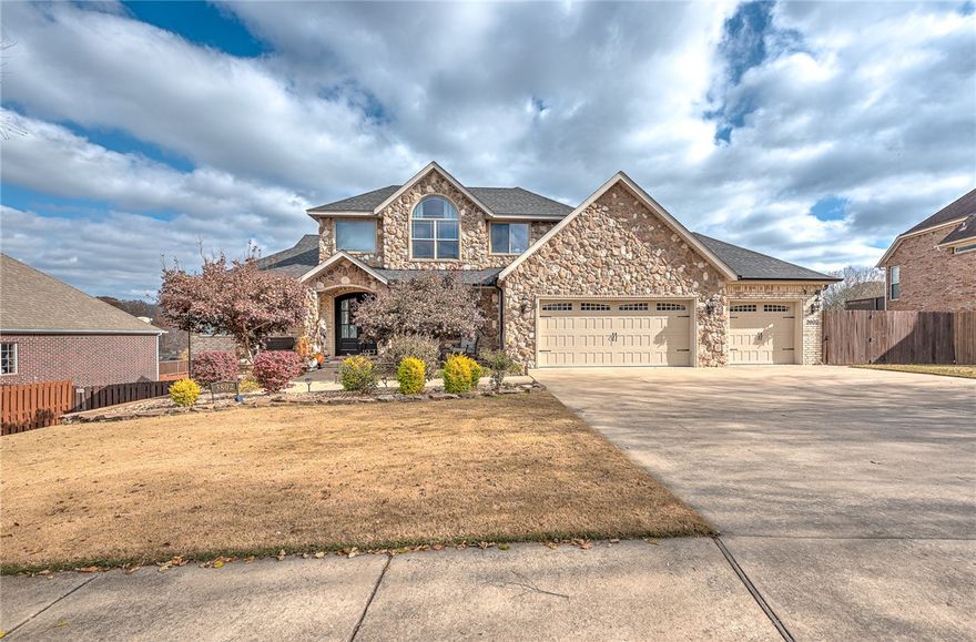 Exquisite 5BD/3.5BA home in Creekstone. Main level showcases a remodeled gourmet kitchen, elegant living area with rich millwork and new flooring, office, and a primary suite with remodeled bathroom/closet. Upper level includes three  bedrooms and full bath. Walk-out lower level features a second living area, wet bar, guest suite, and fenced backyard access. Elevated deck offers privacy with no homes behind. Private pool. Three-car insulated garage, upscale craftsmanship throughout, and prime location minutes from I-49, schools, trails and downtown Bentonville. New roof 2023. Upstairs and basement HVAC replaced 2023.