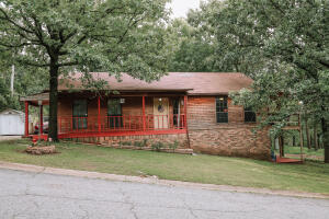 This beautiful well-kept home located right outside of city limits is ready for its new owners! Main level consists of master bedroom, kitchen, living and dining while downstairs has 2 bedrooms and a bathroom! Backyard access from both bedrooms downstairs! Be close to the lake and fish when you want to! Enjoy the deck this summer! Roof replaced in 2018. AC Unit and Hot Water Tank about 5 years old. Refrigerator in kitchen, washer and dryer to convey. Don't miss this one!