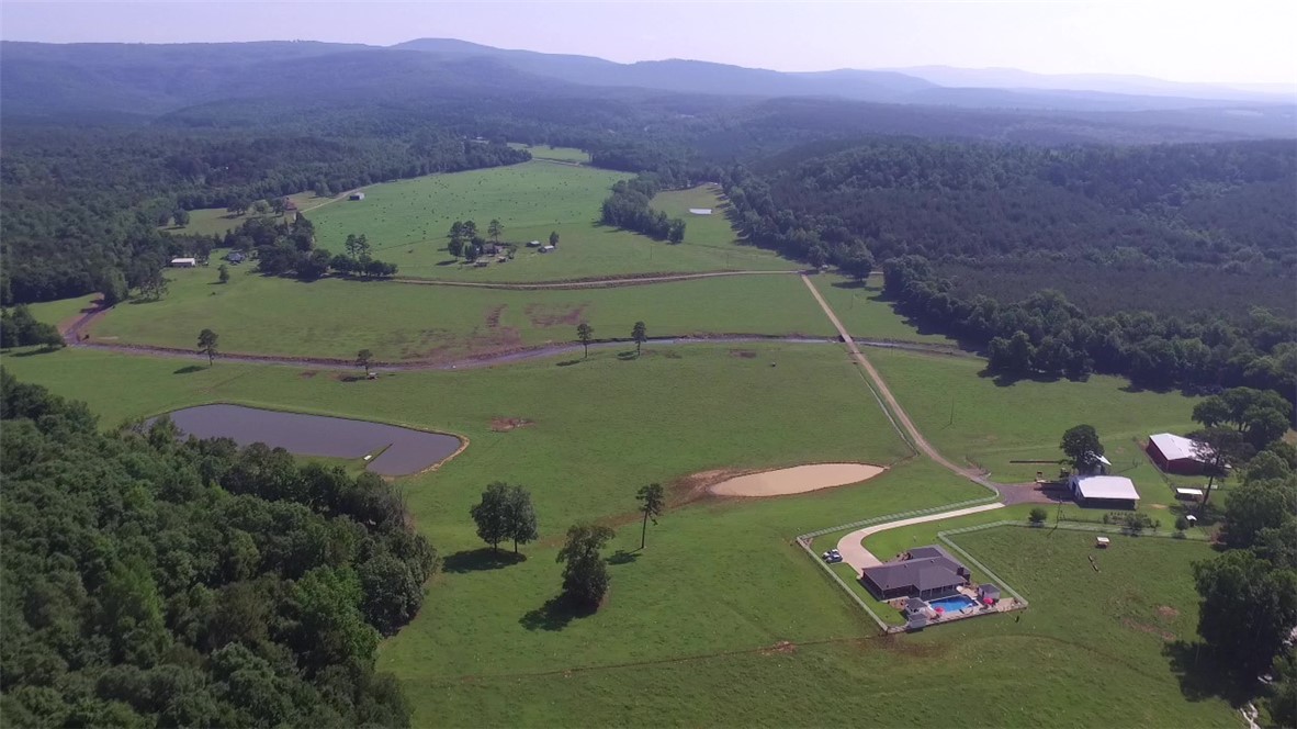 ONE OWNER, HORSE AND CATTLE PARADISE with BEAUTIFUL views in the OZARK MOUNTAIN foothills. This PRISTINE 197+/- acre cattle farm is manicured and turnkey ready for the new owners. SIX PONDS and THREE CREEKS provide year round water in addition to a MUNICIPAL WATER supply and a DEEP WELL for gardening/livestock. This CUSTOM BUILT 2600+/- sft home has NEW ROOF w/transferable LIFETIME WARRANTY SEPT. 2021, NEW HVAC MAY 2021, NEW WATER HEATER 2020 and FIBER OPTIC INTERNET. Call today for a showing!