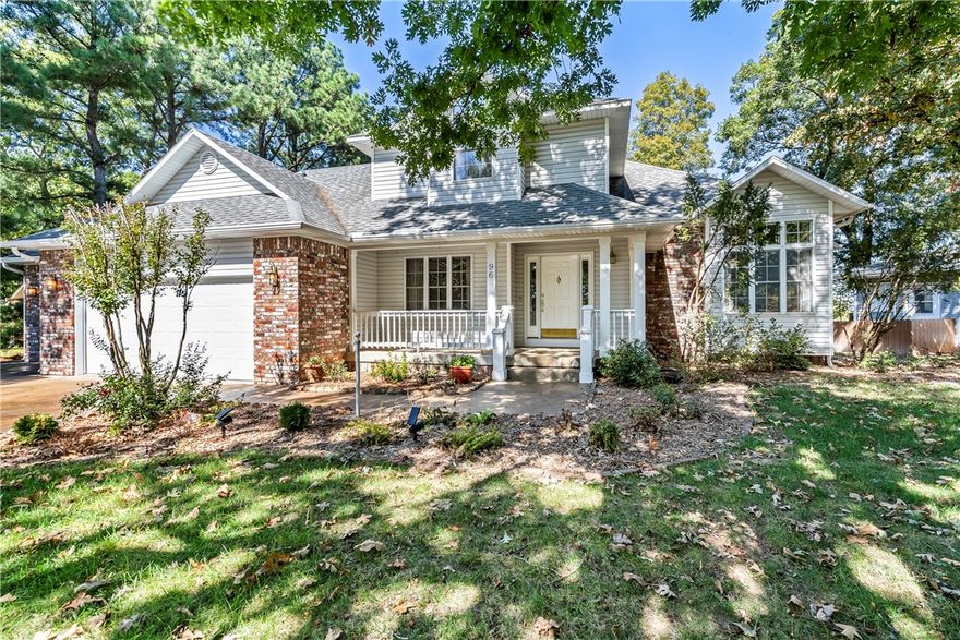 Turn-Key VRBO Overlooking the Golf Course! You'll enjoy this beautiful home on the 18-hole golf course operating as Holiday Island Fairway Estate. The 3BR//2.5 BA home has great curb appeal on a corner lot with large oaks and a covered front porch. The front entry room is spacious and could be used for dining or card games. The adjoining living room has a gas-log fireplace and a window seat with a stained-glass window. The kitchen offers abundant storage and counter space, double electric ovens, and a gas Thermador cooktop. A master suite on the main floor has a large walk-in closet. There are two large bedrooms and a full bathroom on the second floor, and a hidden room behind a hallway bookcase. Sellers have installed new CH&A and added a mini split in the sunroom. The sunroom and deck overlook the fairway, and there's a secluded hot tub and a fire pit and patio. There's always plenty to do, being an easy drive to downtown Eureka Springs, Roaring River State Park, Dogwood Canyon Nature Park and Branson.