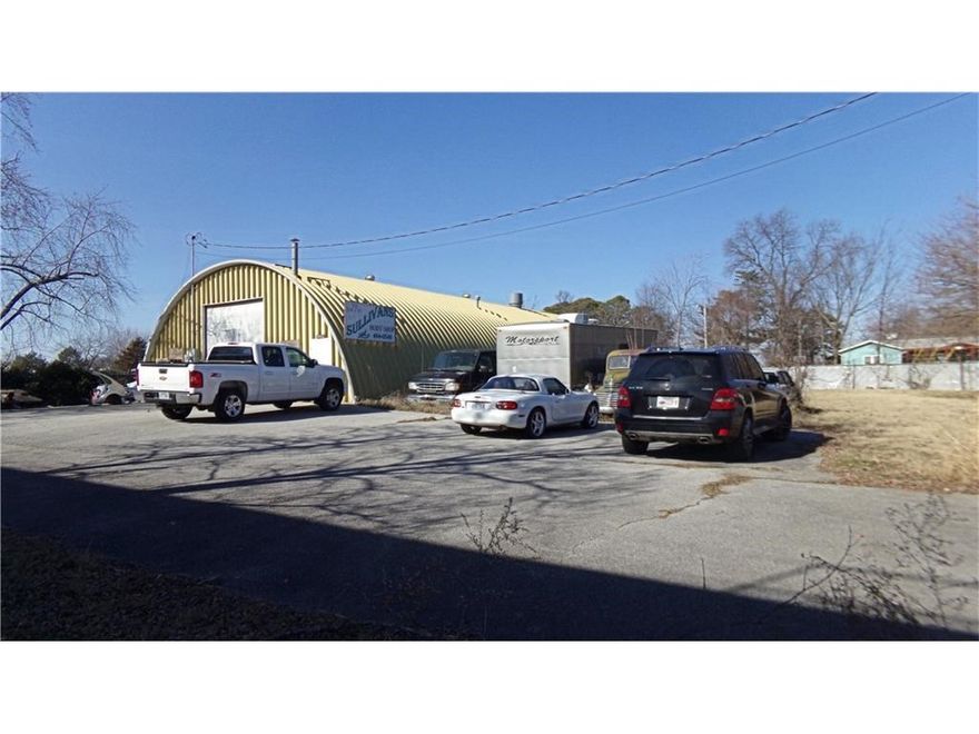 This location is unbelievable! Directly behind Walmart Home Office, and minutes from downtown Bentonville. Wired' for 3 phase Electric, 24 tie downs posts in floor for framework. Drive through Drive through down draft Metal paint booth, Dimensions 14W x 24L x 9H City water main right in street when drive into property. Shop drive through 12 x 12 roll up doors. Heat and AC in waiting room, offices, kitchen and bathrooms. Fully spray foam insulation Call to schedule your showing today!