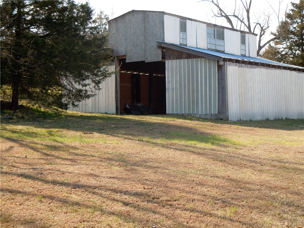 Level part pasture and partially wooded, goes to the center of the creek on the back for over 1600 Feet of Creek Front. 30 X 30 Barn and level building sites. Close to Kings River access.