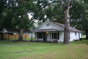 Very cute doll house...NEW ROOF & NEW HEAT & AIR! Remodeled 2 bedroom 1 bath home located in convenient location. This home is on 1 and 1/2 lots and offers a carport. Close to banks, and restaurant's. This is a must see.