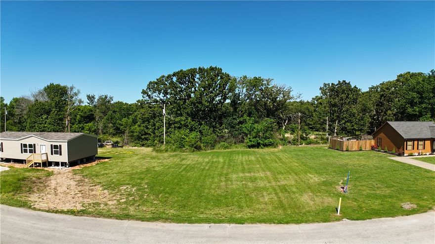 Prime 0.25-acre level lot located just minutes from Downtown Gentry! This open parcel is ready for development with ample space and access to all utilities. Being zoned R-4, it allows mobile homes and single-family residential builds included in zoning of R-1 through R-3. Enjoy the charm of small-town living with easy access to schools, local shopping, dining and everyday amenities. A great opportunity in a growing area with endless possibilities.