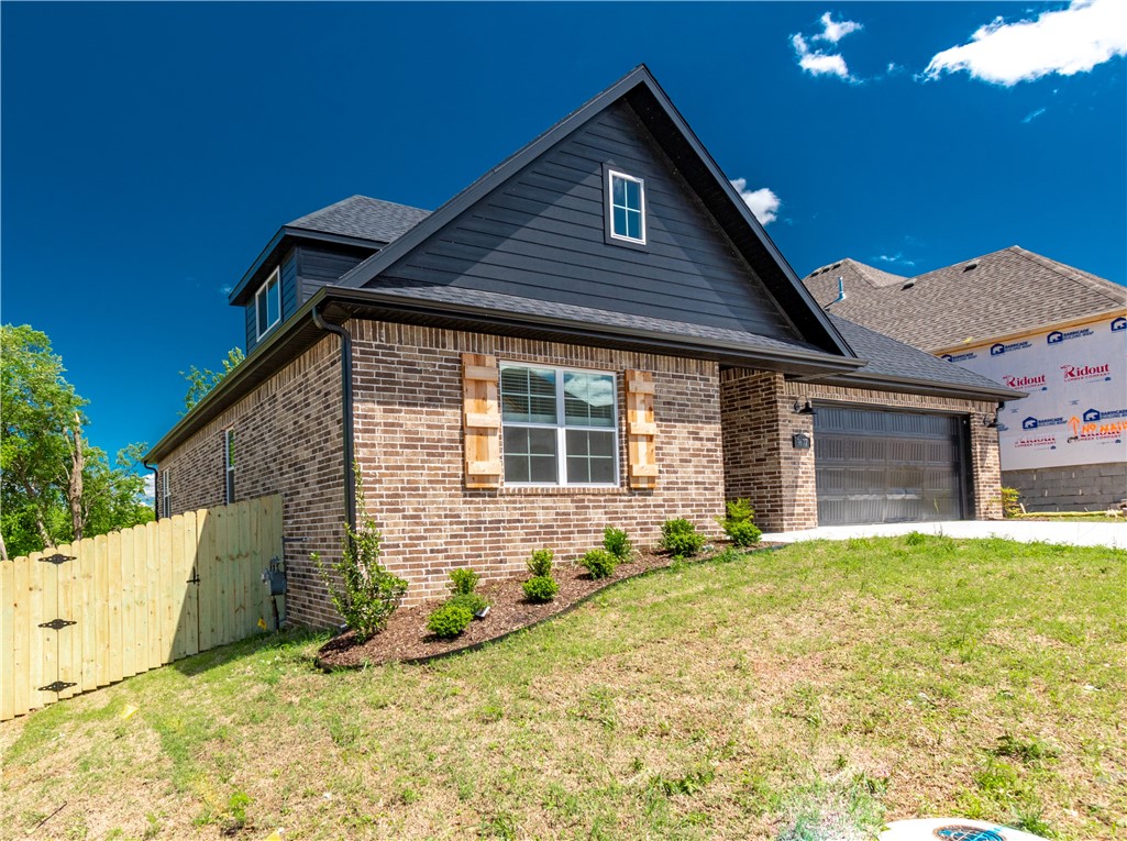 Beautiful brand new home on a corner lot in Henderson Park subdivision in East Fayetteville! Home is 3 bedrooms, 2 baths, with a spacious bonus room upstairs! Features include: a spacious open/split layout, big kitchen with double island overlooking the living room, stunning hardwood floors, custom built cabinets that reach to the ceiling, quartz counter tops, large partially covered deck, gas range, and so much more! Home is within walking distance to Lake Fayetteville, Razorback Greenway trail system, and the Botanical Gardens of the Ozarks!