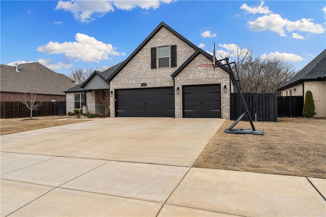 Come see this beautiful West Springdale home, located in Benedetto Subdivision, just off Har-Ber Ave. Completed in late 2020, this one owner home offers an open floorplan with 4 bedrooms, 3 full baths, a large dining space, huge upstairs bonus room, and 3 car garage. The living room features spanning wood beams in the ceiling, a cozy brick fireplace, and beautiful built in cabinetry. The Kitchen has stainless appliances, gas cooktop, large pantry, and huge island with extra storage and seating. The primary suite has double sinks, a jetted tub, tiled walk-in shower, and two walk-in closets. Out back you will find ample space for kids and pets to play, along with a large deck and pergola for entertaining. The front yard also has an invisible fence to help keep pets from escaping. The neighborhood HOA includes a pool and sport court for pickleball & basketball. Right around the corner from Har-Ber High, Hellstern Middle, and Young Elementary. Golf, shopping, hospitals, and restaurants all nearby.