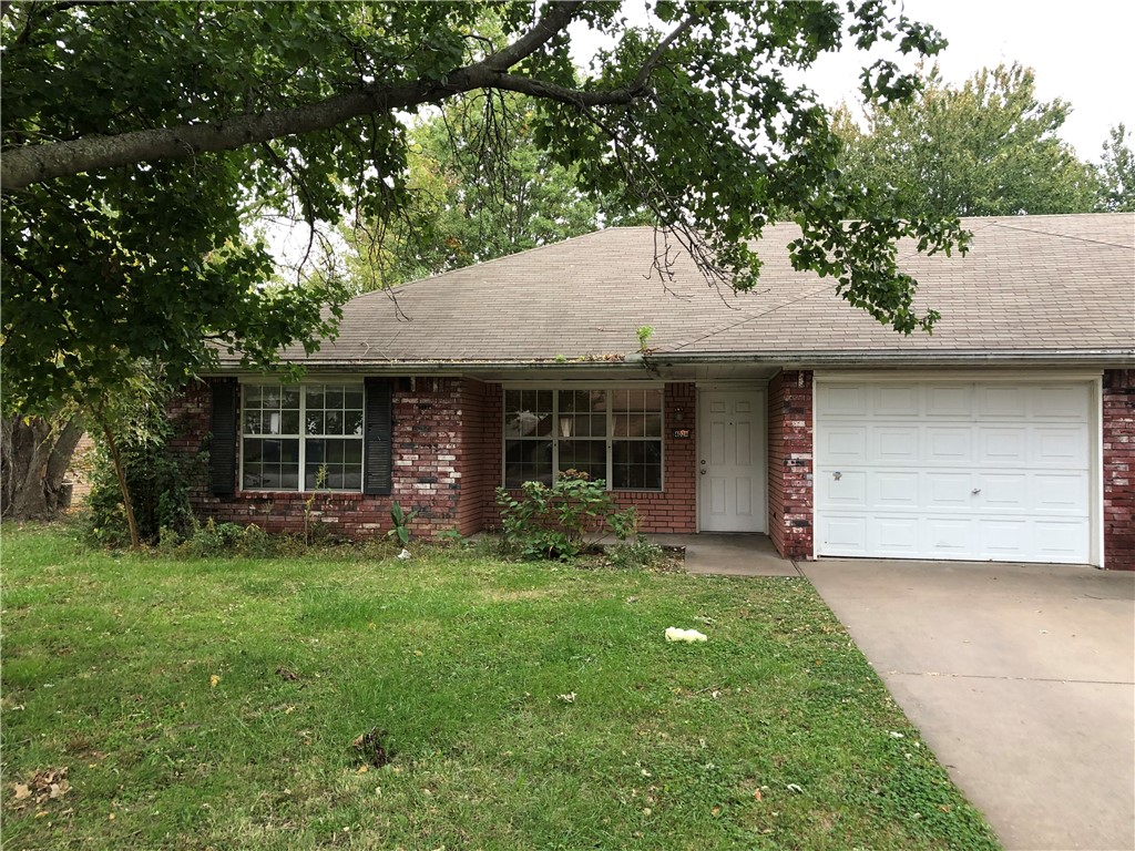 Clean 2-bed, 2-bath duplex just across 14th Street from the new Walmart headquarters. Large living room, kitchen and dining areas with a pantry and separate laundry room. Has electric range and dishwasher. Refrigerator and microwave are also provided. Laminate flooring in the living room, hall and bedrooms. Ceramic tile flooring in the dining, kitchen, laundry areas and bathrooms. Tenants may use the existing washer & dryer, but condition is unknown, and they will not be repaired or replaced by the owner.