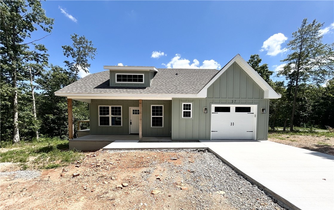 Discover this stunning new cons't craftsman style home located near the Loch Lomond boat launch and provides easy access to Highlands Golf Course, Branchwood trail, & 1-49. This exquisite home sits on a FLAT .34 acre wooded corner lot and boasts high-end finishes throughout! Step inside to find a stylish open-concept layout, adorned with wood floors. (no carpet) The focal point of the home is the kitchen, equipped with custom cabinets, a wood hood, luxurious countertops, & a large kitchen island. You'll love cooking with premium stainless steel appliances, including a gas range. Retreat to the primary bath, where you'll find a spacious walk-in tile shower & double vanity. 2 bedrooms / 2 baths. Plus, take advantage of $3,500 in buyers closing costs, courtesy of the builder's preferred lender! Approx completion date - 7/10/25. This home is eligible for RD financing (no down payment).
