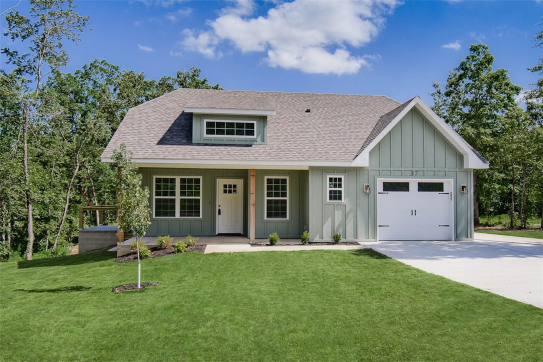 Discover this stunning new cons't craftsman style home located near the Loch Lomond boat launch and provides easy access to Highlands Golf Course, Branchwood trail, & 1-49. This exquisite home sits on a FLAT .34 acre wooded corner lot and boasts high-end finishes throughout! Step inside to find a stylish open-concept layout, adorned with wood floors. (no carpet) The focal point of the home is the kitchen, equipped with custom cabinets, a wood hood, luxurious countertops, & a large kitchen island. You'll love cooking with premium stainless steel appliances, including a gas range. Retreat to the primary bath, where you'll find a spacious walk-in tile shower & double vanity. 2 bedrooms / 2 baths. Plus, take advantage of $3,500 in buyers closing costs, courtesy of the builder's preferred lender! This home is eligible for RD financing (no down payment).