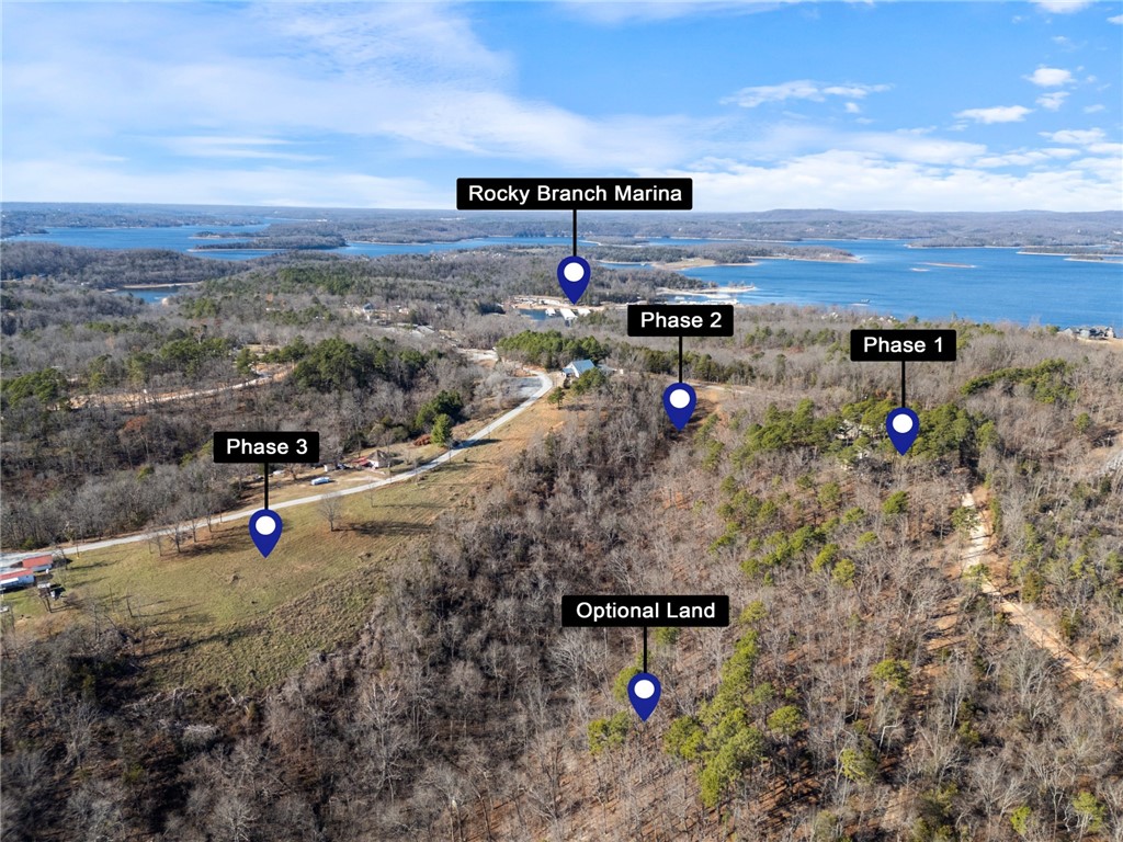 DEVELOPER'S DREAM 17+Acres, with 12 undeveloped Deeded lots, 7.78 acres wooded with Seasonal Spring, 1 Boat Slip with automatic lift. Primary Home with 4,400 sf 5 Bedrooms, 3.5 Baths, Secondary Home 1,000 sf apartment includes master and 3 Bunks. Great Airbnb income with two additional full RV hookups, garage 1000 sq feet with bath. The 12 lots include water, electricity, and internet services at Road, septic is required. First time offered Development with so much potential of 12 deeded lots. An opportunity to expand on 7+ optional acres for camping sites or Airbnb's or individual Family estate.