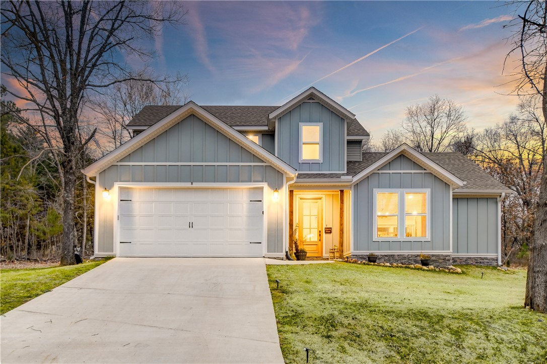 Discover serenity in Bella Vista: Your Dream Home Awaits at 8 Boswell Circle, nestled on a spacious 0.34-acre lot with a large, flat backyard perfect for playdates or peaceful evenings. This immaculate 2022-built gem spans 1,985 sq ft of pure elegance, boasting 3 bedrooms, 2.5 baths, and a versatile office/study—designed for modern living with tasteful, gorgeous finishes inside and out, including stainless appliances, granite countertops, and an appealing stone fireplace surround.Retreat to the large private primary suite, featuring a luxurious stand-alone soaking bathtub. Step onto stunning wood floors and ascend the beautiful staircase to your private oasis—no neighbors behind or on either side for ultimate tranquility. The adorable dining area sets the stage for cherished family gatherings.Priced to sell, this rare find blends luxury, privacy, and charm. Schedule your tour today—your forever home is calling!