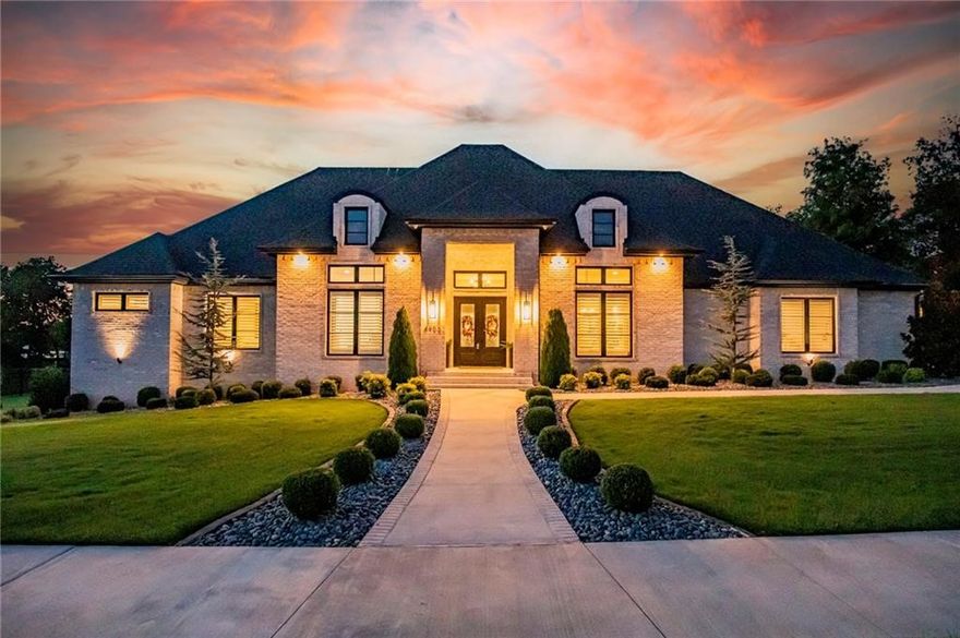 This custom-designed resort-style home on one acre has every imaginable amenity to cater to your comfort. Every inch of this unique home speaks quiet luxury, boasting 4 ensuite bedrooms, gourmet kitchen, walk-in pantry, formal dining, office w/ built-ins, spacious family room w/ kitchenette & 2 half baths. The real lifestyle perks take place poolside and within the private 24x24’ covered outdoor-living space complete, impressive blaze kitchen, Godfrey & Black fireplace, & Jack Wills patio heaters for year-round relaxation and entertaining. Also includes a whole-home generator, mini-split in side garage, plus built-in cabinets in the spacious garage. Automated Blinds/window treatments & alarm/sound system installed throughout home. 428 square feet of heated and cooled add space w mini split that could be used as a workout space. With no detail overlooked, this one-level 4,750-sf haven flaunts too many extraordinary features to list in one paragraph; be sure to see the comprehensive list of customizations & upgrades.