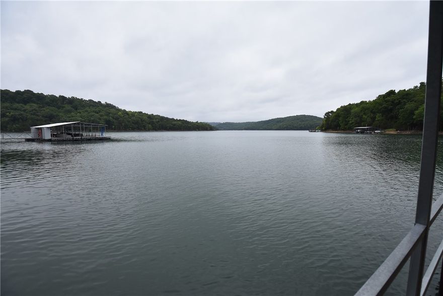 Opportunity knocks with this property. Your only limits are your imagination. The property consist of a 2577 sq. ft. home on 0.909 lakefront acres with a BRAND NEW 2 covered slip PRIVATE boat dock with swim platform. There's also a gravel drive down to turn around/parking very close to the dock. The home is 3 bd, 3ba, 2 living, with 2 car attached garage with enclosed breezeway between home and garage for extra living space and decks front and back. The home could use remodeling or replace it with new. The location is what you want. Call to schedule your showing today!