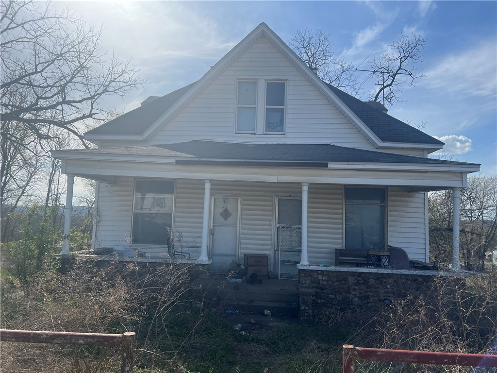 This 1915 former Parsonage to the Old Grandview Church has lots of charm hidden inside 4 bedrooms 2 bathrooms formal dining, sun room and full basement. It will need some TLC to bring it back to its former glory. Home and garage sit on 4 lots and seller will have survey done before closing. Property is being sold "As Is" perfect for a flipper.