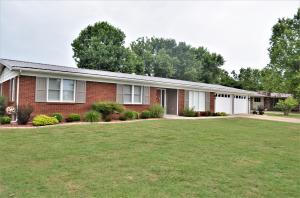 Are you looking for a home just the right distance from town? This is it! This 3 bedroom 2 bath ranch style home sits at the end of a road in a quiet well developed neighborhood. With beautiful farm land behind you can sit on your back porch and see horses, deer and birds. While this house was built in 1968 it was recently remodeled with new flooring, appliances, fixtures and paint. You get the solid sturdy construction of days gone by with modern touches. There is a large two car garage with a storage room attached. The house features an open floor plan and it has a fenced in back yard. You'll want to see this one!
