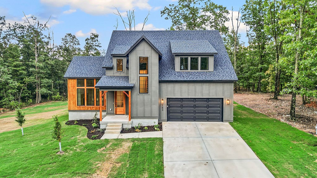 Gorgeous new showstopper on a large, flat, lot built with quality by White Mountain Construction! Open your new front door to immediately be engulfed by streams of natural light beaming from the oversized windows along the back wall. A soaring ceiling with beams awaits you in the living room with an exquisite fireplace and more natural light from all the windows. Living room opens to a gorgeous kitchen with stainless appliances, modern cabinets, quartz countertops with quartz waterfall island and large dining area. Primary bedroom on main level with big walk-in-closet including a washer and dryer hookup. Ensuite has dual vanities, custom tile shower and soaker tub. Powder room and large garage with mud area round out main level. Upstairs, you’ll find a loft that would make a great flex space or office, two guest bedrooms, full bath, second laundry room and a bonus room (could be a 4th bedroom). Covered, corner back porch with wood ceiling opens to a huge flat backyard. Close to trails, Loch Lomand and lots of golf!