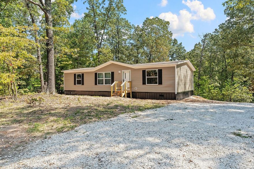 Charming 3-bedroom BRAND NEW manufactured home with 2 full baths on 1.27 Acres nestled on a peaceful lot in Weddington Woods. This brand new home offers the perfect blend of comfort and functionality. The open and inviting floor plan provides ample living space, while large windows fill the home with natural light. Enjoy the privacy and space of country living while still being conveniently located near local amenities and schools. With plenty of room to expand and endless possibilities, this property is a rare find in the growing Fayetteville area. It is about 10 minutes from I-49. Don’t miss this opportunity—schedule a showing today!
