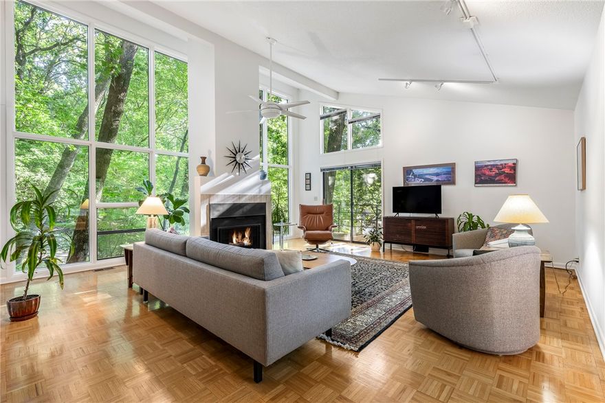 Peacefully located at the ends of Berry & Eva streets, this well-maintained home features many hallmarks of James Lambeth design, including passive-solar features like abundant South-facing windows, ventilation through the stair volume, & mirrored design element over front door.  Kitchen & Primary Suite have been updated with custom Douglas Fir cabinets & closet systems featuring incredible storage capabilities.  3 bedrooms plus dedicated office (could be a guest room) plus an extra bonus room in basement.  Levels 1-3 provide 2384 SF of living space, basement has 403 SF of finished bonus space perfect for a variety of uses.  Includes adjacent 2nd parcel for an impressive woodland setting.  Sunset Woods Neighborhood trail up to the newly renovated pool is located between the 2 parcels.  Just blocks to the 18-mile Fayetteville Traverse MTB loop, many neighbors enjoy walkability to Leverett Elem & UA Campus, easy access I49.  Privacy fenced side yard with secluded Hot Tub.  Floor plan & French drainage plan available.