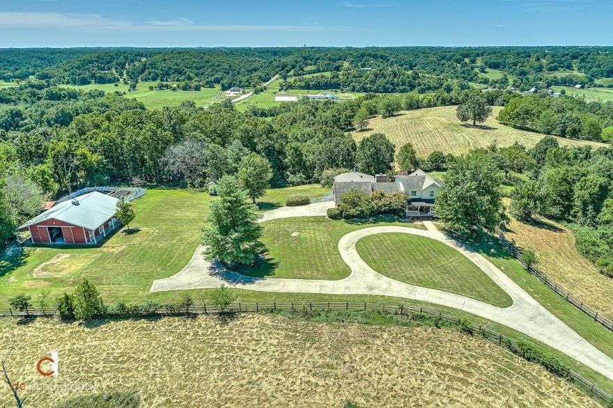 GORGEOUS AND PRIVATE MOUNTAINTOP RETREAT OFFERING SPECTACULAR VIEWS OF THE VALLEY AND MOUNTAINS JUST 3 MILES TO I-49, 15 MIN TO WALMART HOME OFFICE & 30 MIN TO XNA!  This one-of-a-kind 55 acre gated horse ranch/gentleman’s farm offers the perfect sanctuary for quarantining complete with 3 level home, 4 stall horse barn w/ tack room, RV storage, ATV storage & shop area!  3 separately fenced pastures for horses or cattle and fenced organic garden w/ 8 raised beds!  Huge deck takes in stunning views and overlooks beautiful in ground pool.  Completely renovated chef’s kitchen w/ stainless appliances & granite, newly added 860 sq ft great room w/ double sided fireplace, main level master retreat, full walk-out basement hosts bonus/game room, kitchenette, full bath and tons of storage!  Large flat yard w/ great breeze that keeps mosquitos away, this hidden gem is a MUST SEE!!!