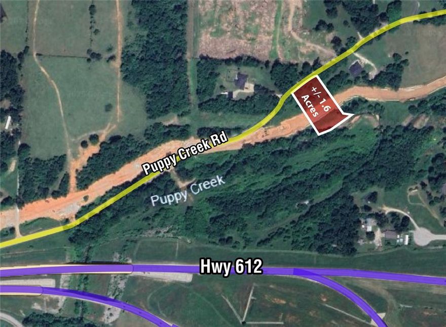 Build Your Dream home on +/- 1.6 acres offering excellent potential for residential development! This property is in the heart of beautiful Northwest Arkansas, close to all amenities: less than 5 minutes to JB Hunt Corporate HQ, less than 10 minutes to Pinnacle Hills Promenade Mall, restaurants, shopping, I-49, 11 minutes to XNA airport, and less than 5 minutes to the new 612. This property has a wooded feel and backs up to a beautiful creek. A +/- 5,000 sf home could be built here, depending on buyers perc test results. The back of the lot is in the flood zone, ideal building spot is to the north side. Lot is still subject to splitting approval with City of Lowell, but verbal conversations have been had and city seems receptive to the split. Septic may be ideal, but sewer line is in Puppy Creek - access to be approved by Lowell/Springdale. It is a Springdale Sewer Line but Lowell Administers it. Buyer would also need a well, but water is on the property to the south so could possibly be negotiated to come north.