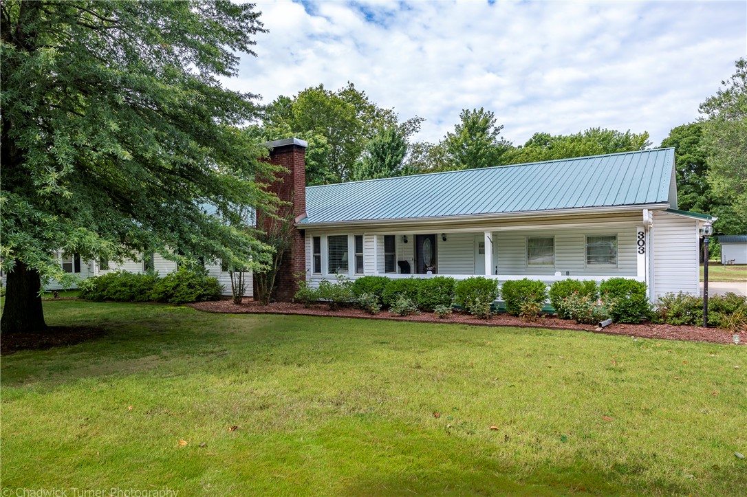 Home is where the heart is...This charming 1950ās ranch style home sets on a huge lot surrounded by mature trees and beautiful landscaping. A covered front porch entry welcomes you into the home with plenty of large windows throughout for an abundance of natural light. This well-maintained home features spacious rooms, a large patio area with retractable awning and fire pit with views of the extensive backyard. *Refer to the full list of updates and improvements attached! This nostalgic mid-century home wonāt last long!